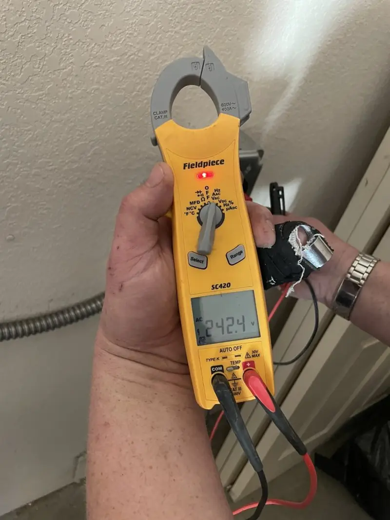 Voltage testing with clamp meter during Electrical Installation Services in Floyd